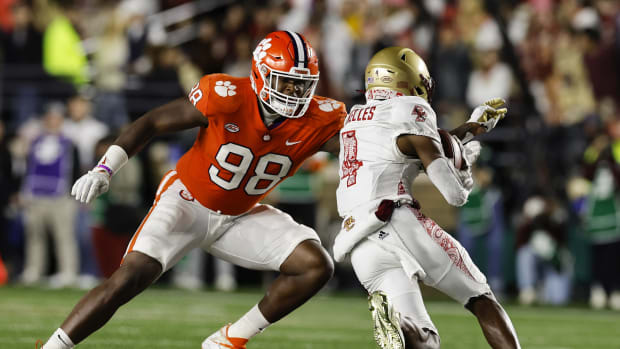 Oct 8, 2022; Chestnut Hill, Massachusetts, USA; Clemson Tigers defensive end Myles Murphy (98) moves to bring down Boston College Eagles wide receiver Zay Flowers (4) during the second half at Alumni Stadium. Mandatory Credit: Winslow Townson-USA TODAY Sports